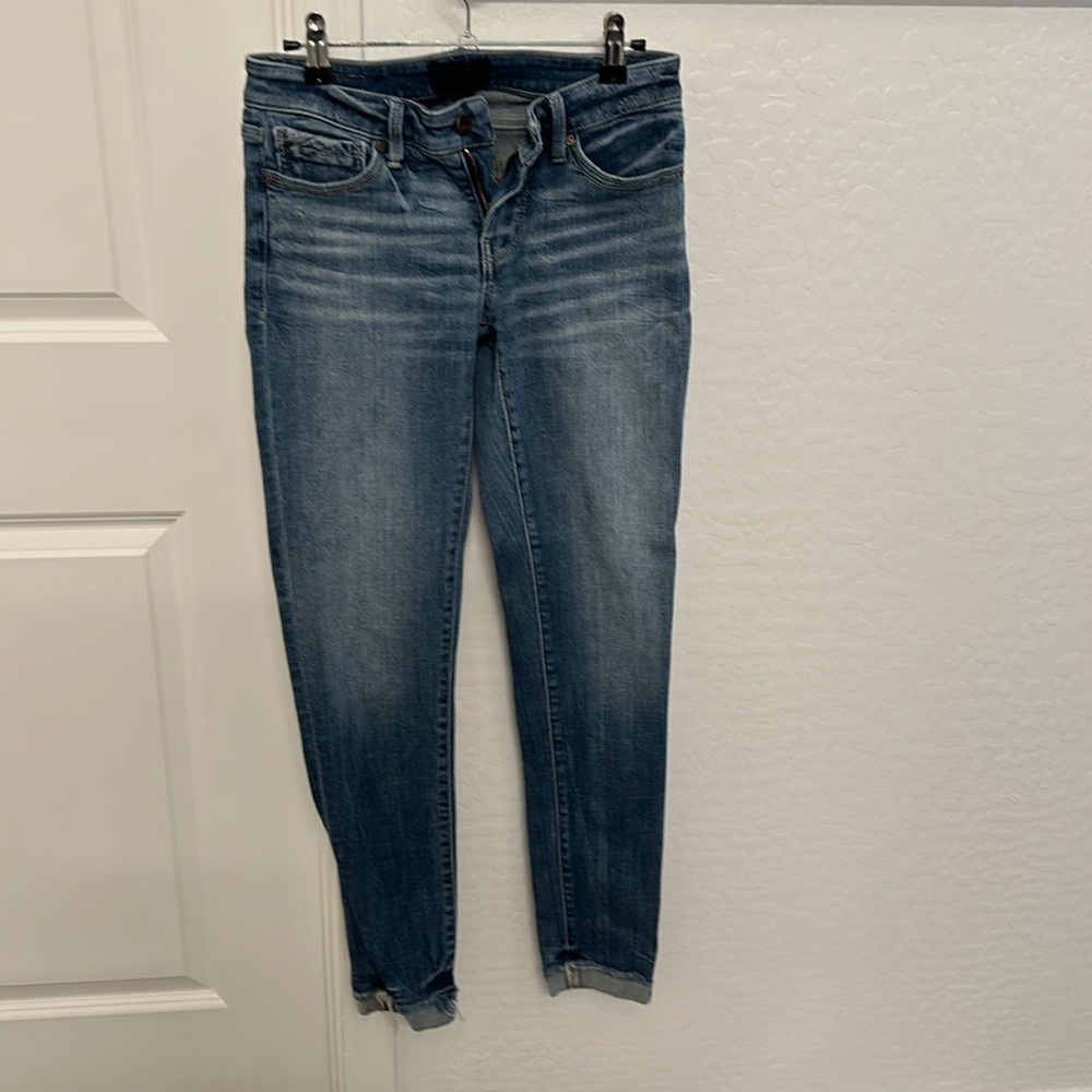 Buckle black ankle skinny jeans